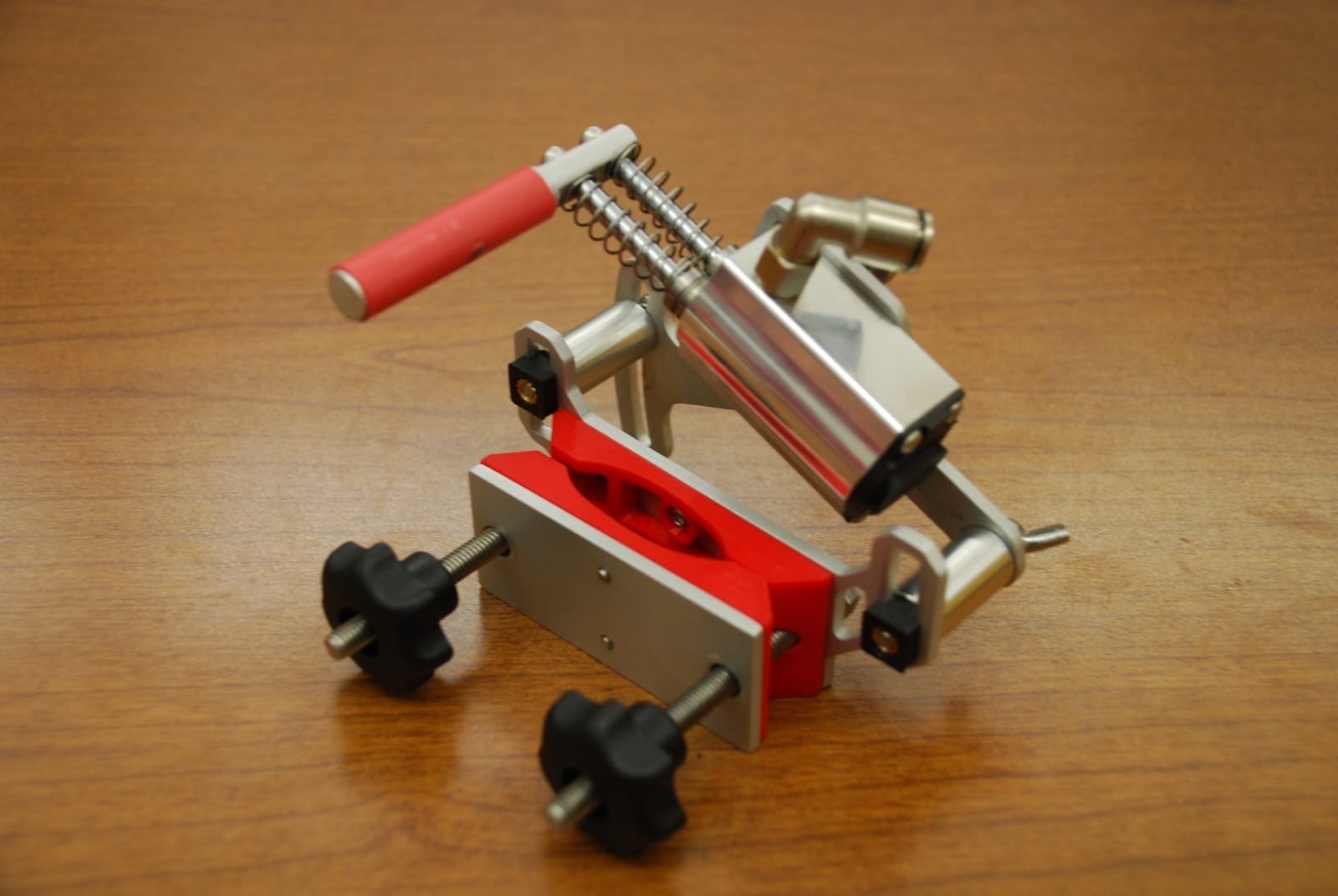 Actuation system designed to clamp on a pistol grip and pneumatically cycle and fire a firearm.